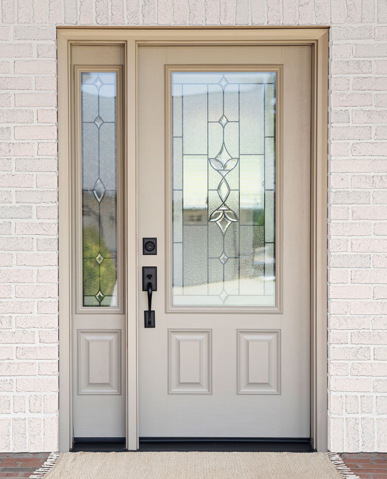 ProVia fiberglass front door in sandstone with decorative glass and sidelite
